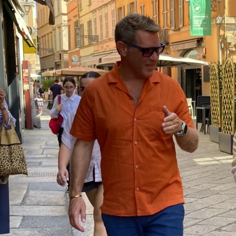 Gil, founder of proof.travel, walking through Parma